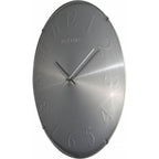 Gray wall clock with 'Nextime' branding on a white background