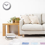 Living room with a beige sofa, wooden coffee table, and decorative pillows.