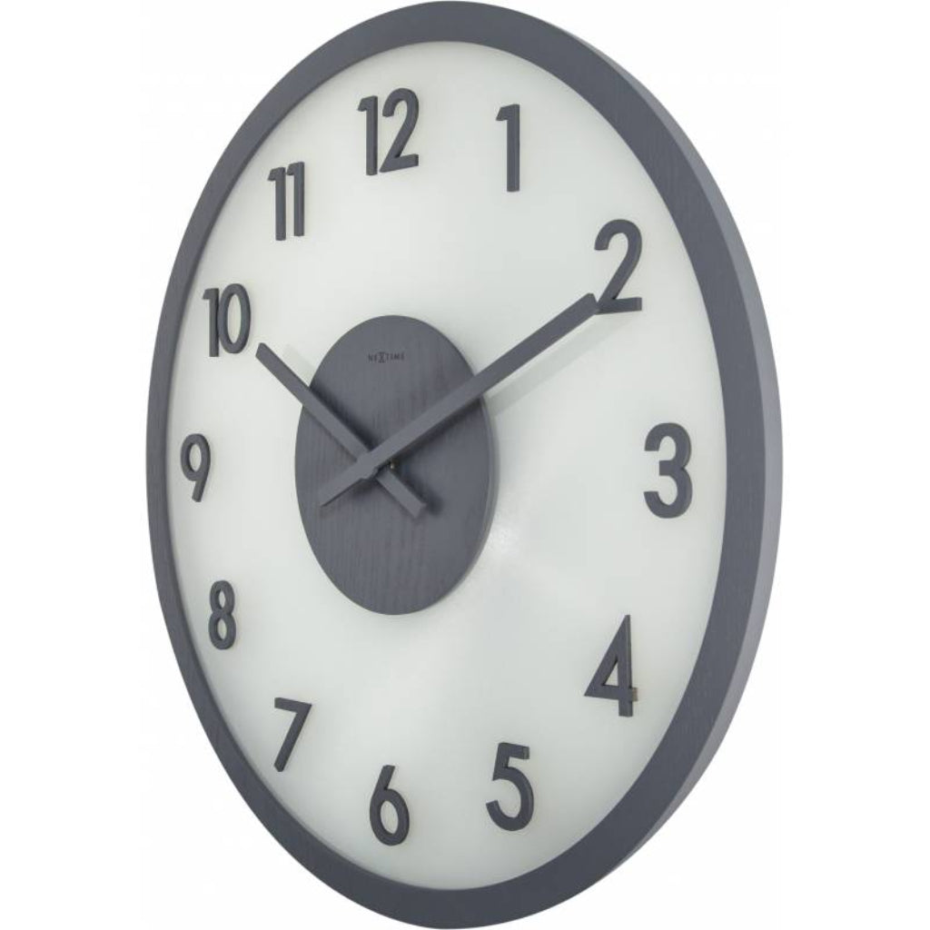 Wall clock with black frame and white face on a white background