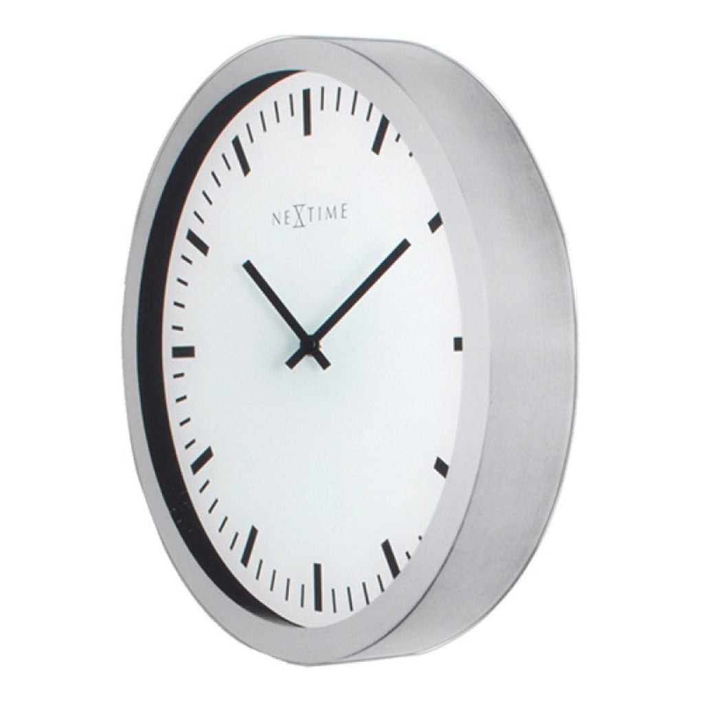 Wall clock with white face and silver frame on a white background from Nextime available at Spacio retail stores in Mumbaii & Kolkata and online.