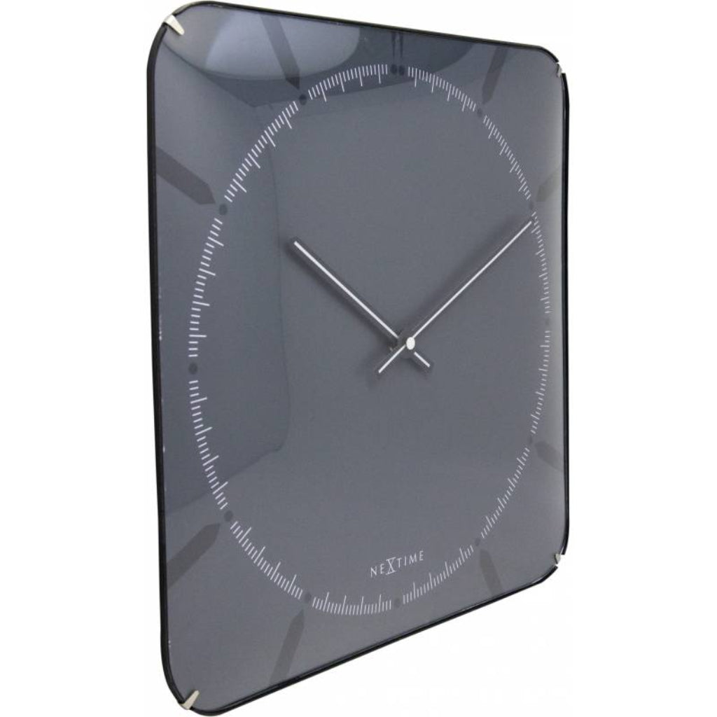 Gray wall clock with white hands on a white background