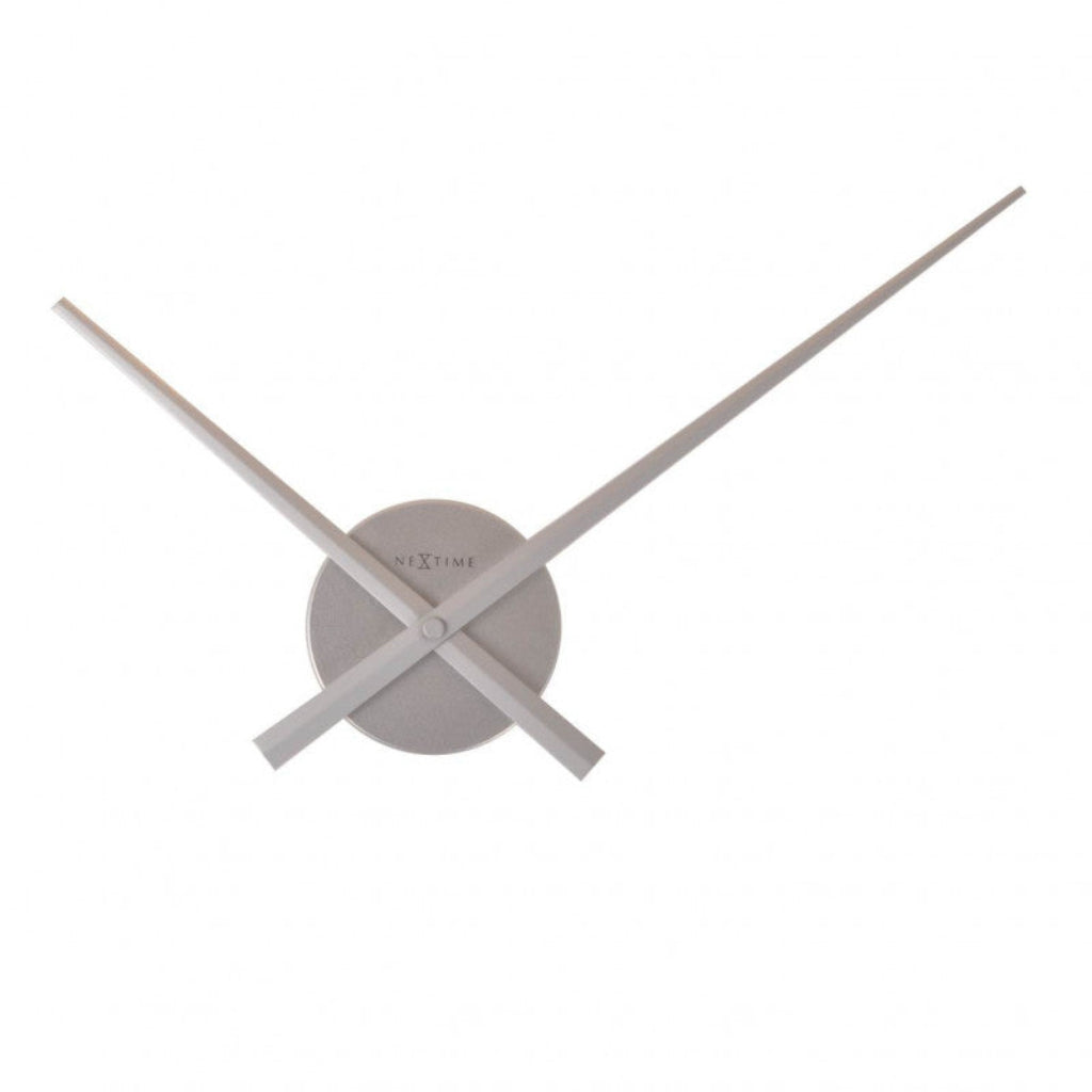 Gray wall clock with long thin design on a white background from Nextime available at Spacio retail stores in Mumbaii & Kolkata and online.