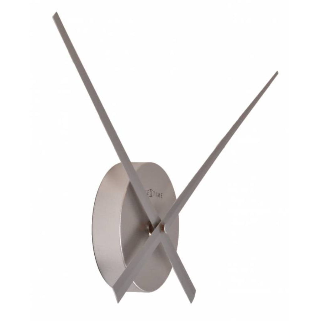 Silver wall clock with long thin hands on a white background