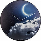 Round wall clock with a design of a moon and clouds, brand 'NeXtime' visible. from Nextime available at Spacio retail stores in Mumbaii & Kolkata and online.