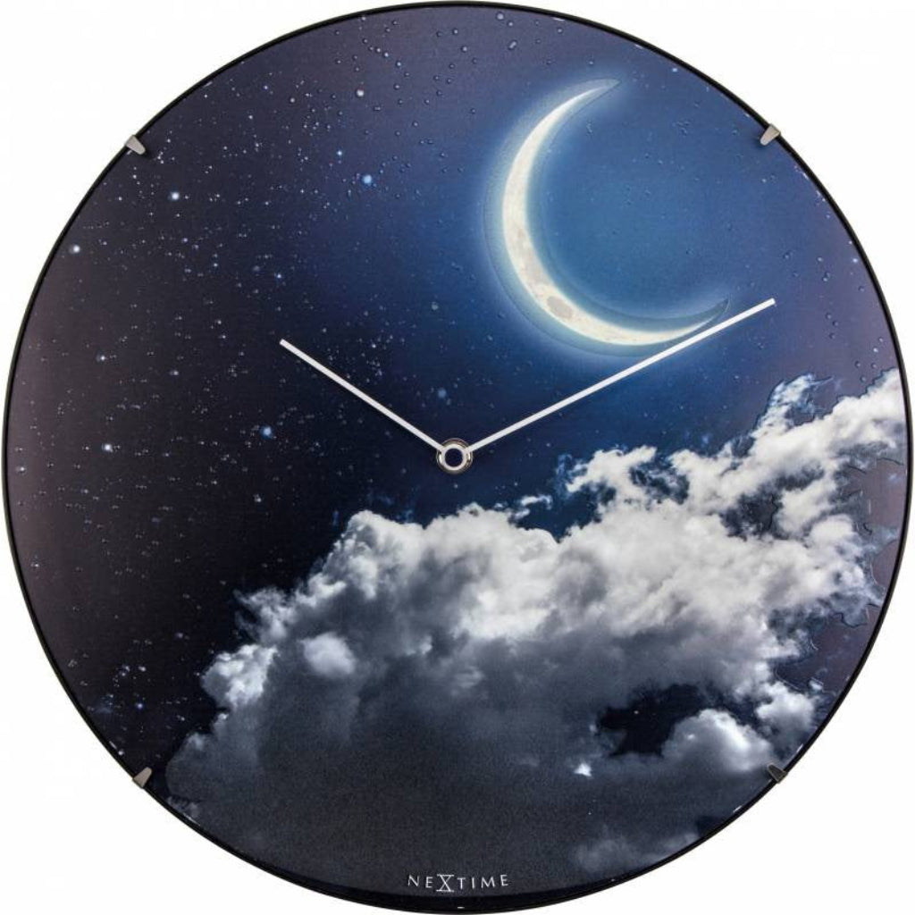 Round wall clock with a design of a moon and clouds, brand 'NeXtime' visible. from Nextime available at Spacio retail stores in Mumbaii & Kolkata and online.