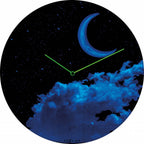 Glowing clock with moon and cloud design on a black background