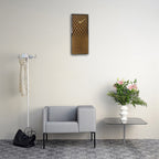 Modern living room with a gray sofa, coat rack, and decorative elements.