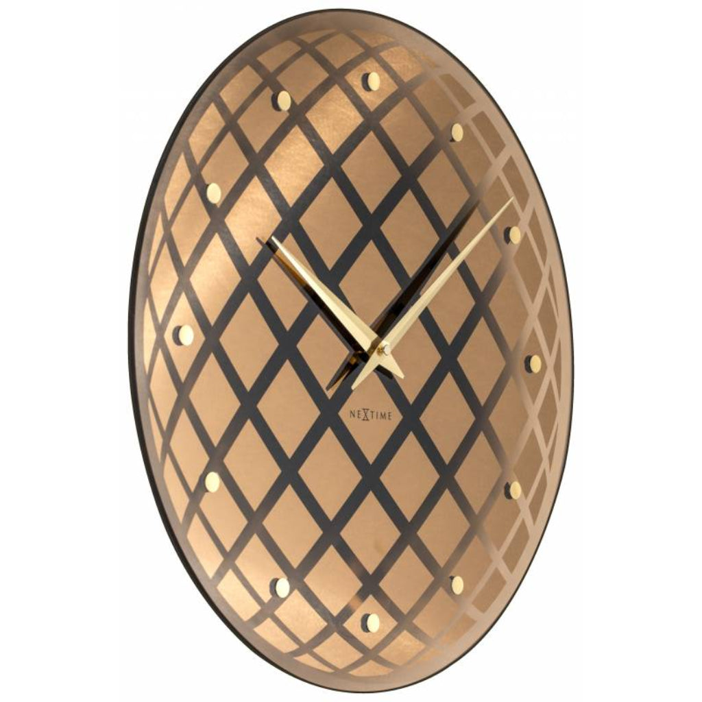 Decorative wall clock with geometric pattern and gold accents on a white background