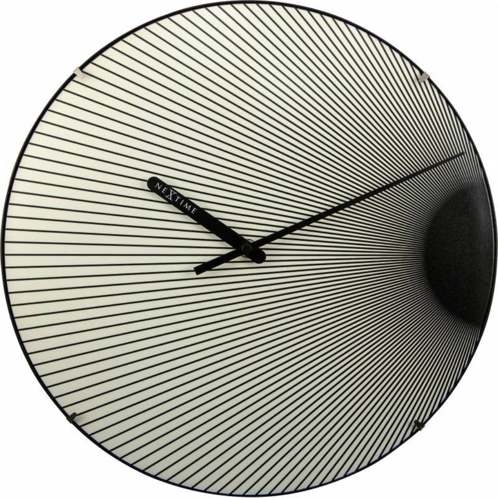 Round wall clock with a unique design on a white background
from Nextime available at Spacio retail stores in Mumbaii & Kolkata and online.