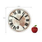 Round wall clock with Roman numerals and a Nextime logo, next to an apple with a Nextime logo on a white background.