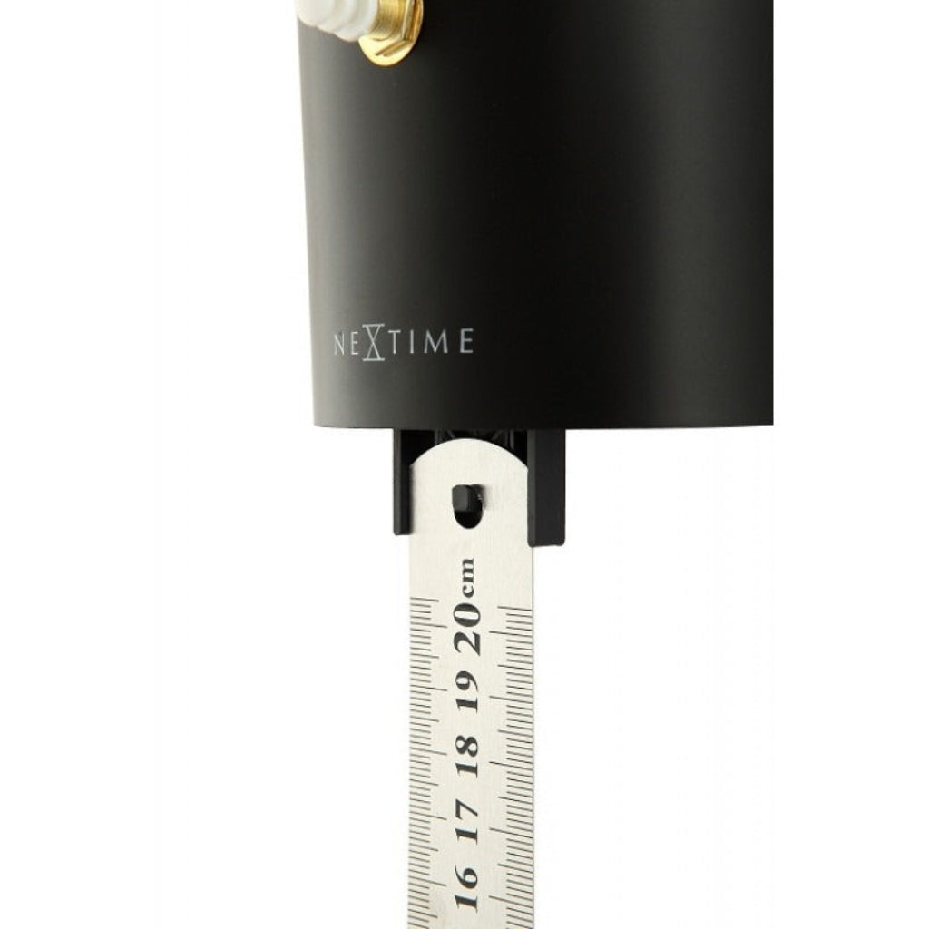Black measuring tool with a ruler scale and 'NeXtime' branding on a white background