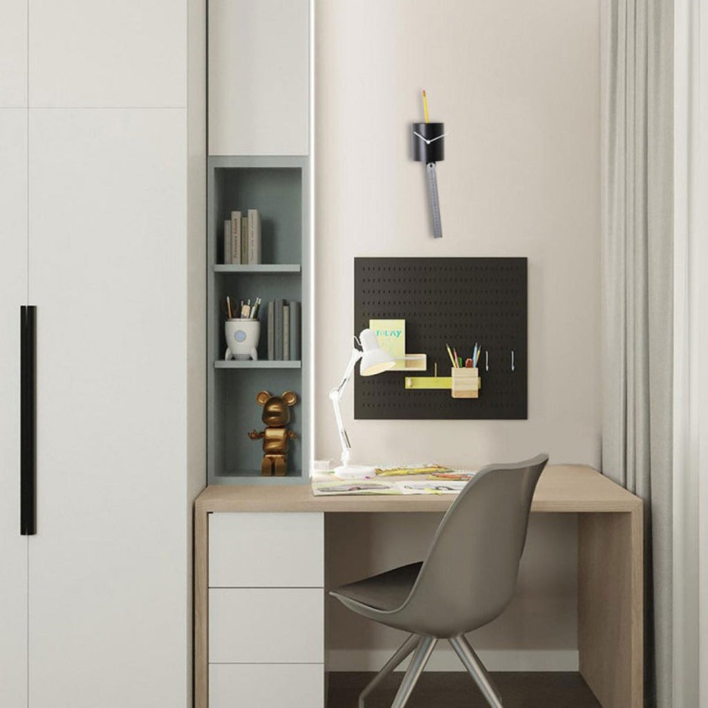 Small home office with a desk, chair, shelves, and wall-mounted clock.