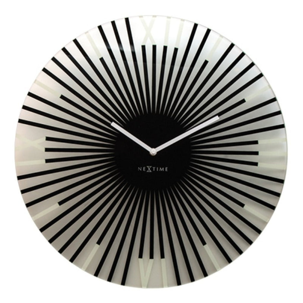 Black and white wall clock with radial design on a white background from Nextime available at Spacio retail stores in Mumbaii & Kolkata and online.