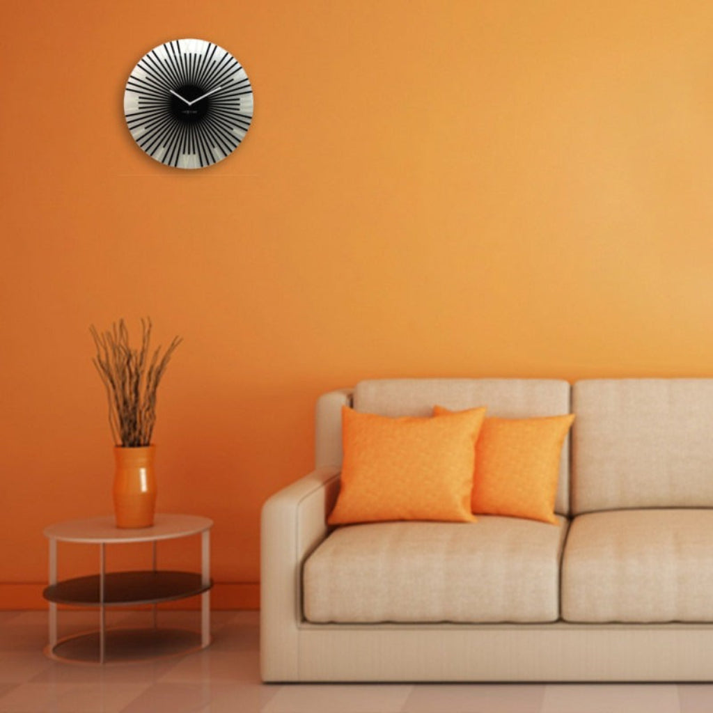 Living room with orange wall, beige sofa, and decorative clock.