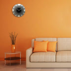 Living room with orange wall, beige sofa, and decorative clock.