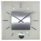 Silver wall clock with brand name on a light gray background from Nextime available at Spacio retail stores in Mumbaii & Kolkata and online.