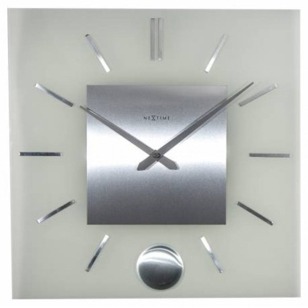 Silver wall clock with brand name on a light gray background from Nextime available at Spacio retail stores in Mumbaii & Kolkata and online.