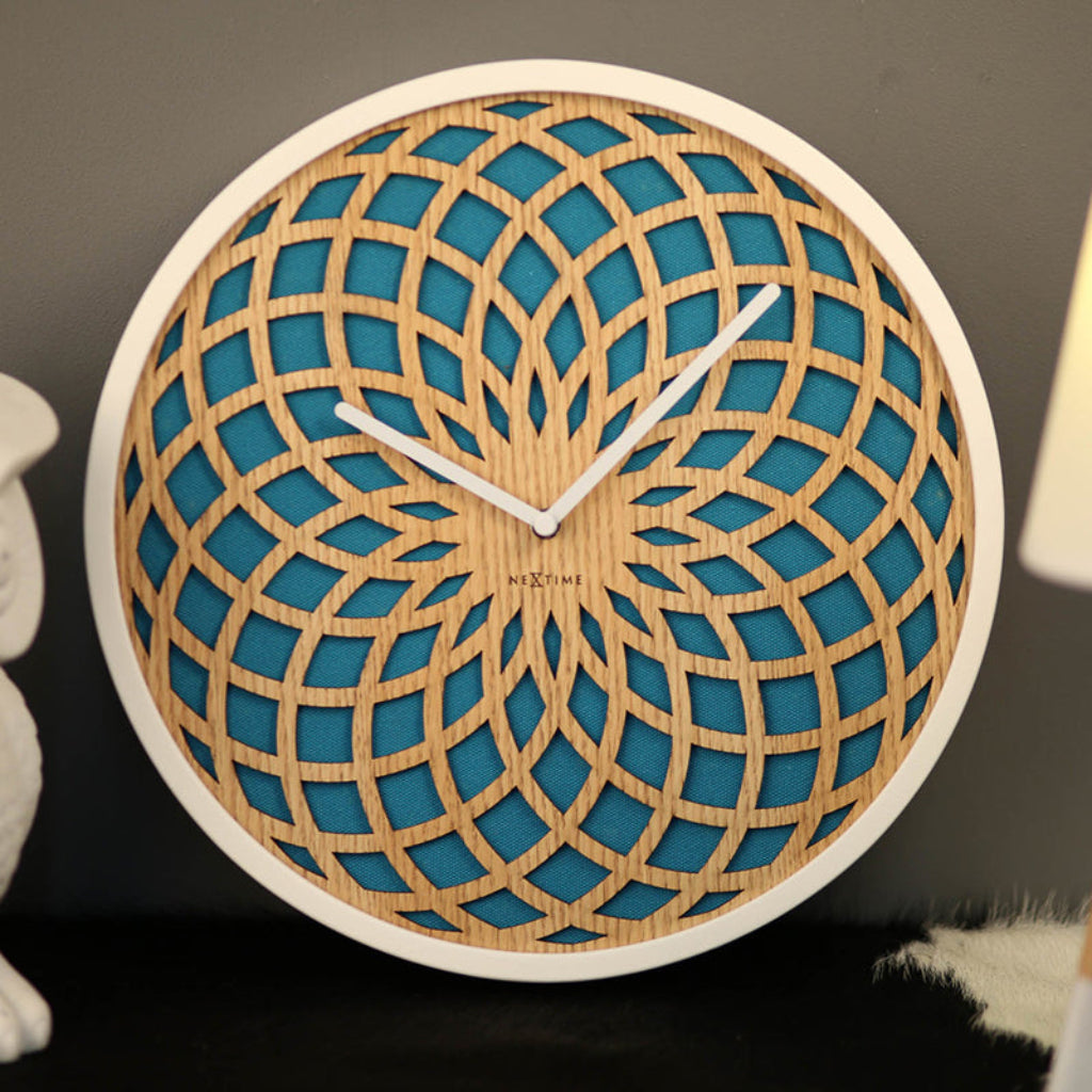 Wooden wall clock with geometric design on a dark background