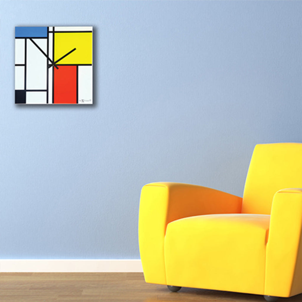 Colorful abstract wall clock on a light blue wall with a yellow armchair.
