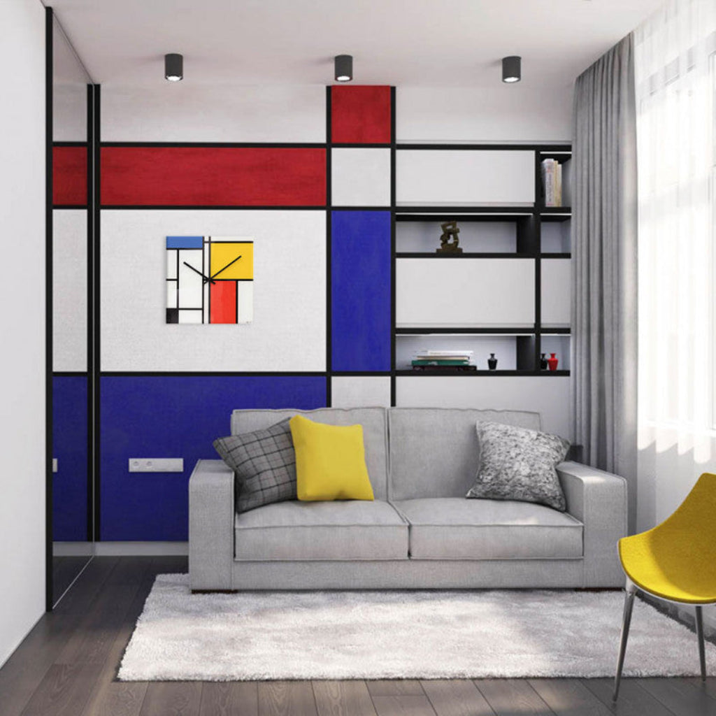 Modern living room with a gray sofa, colorful abstract wall art, and a yellow chair.