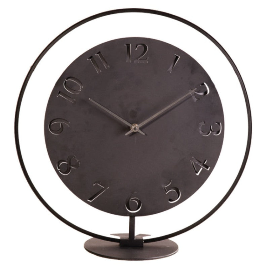 Decorative clock with black metal design on a white background from Nextime available at Spacio retail stores in Mumbaii & Kolkata and online.