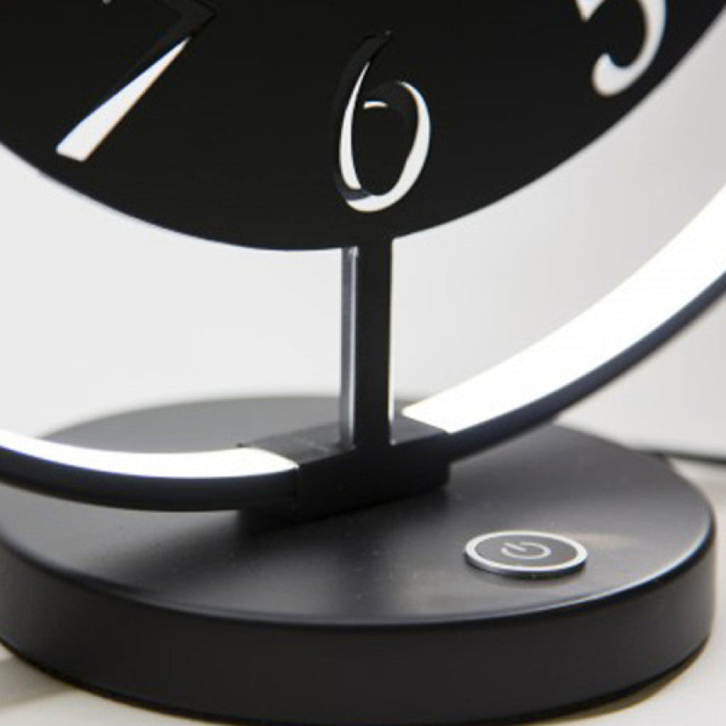 Black and white clock with a power button on a white background