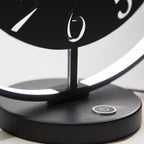 Black and white clock with a power button on a white background