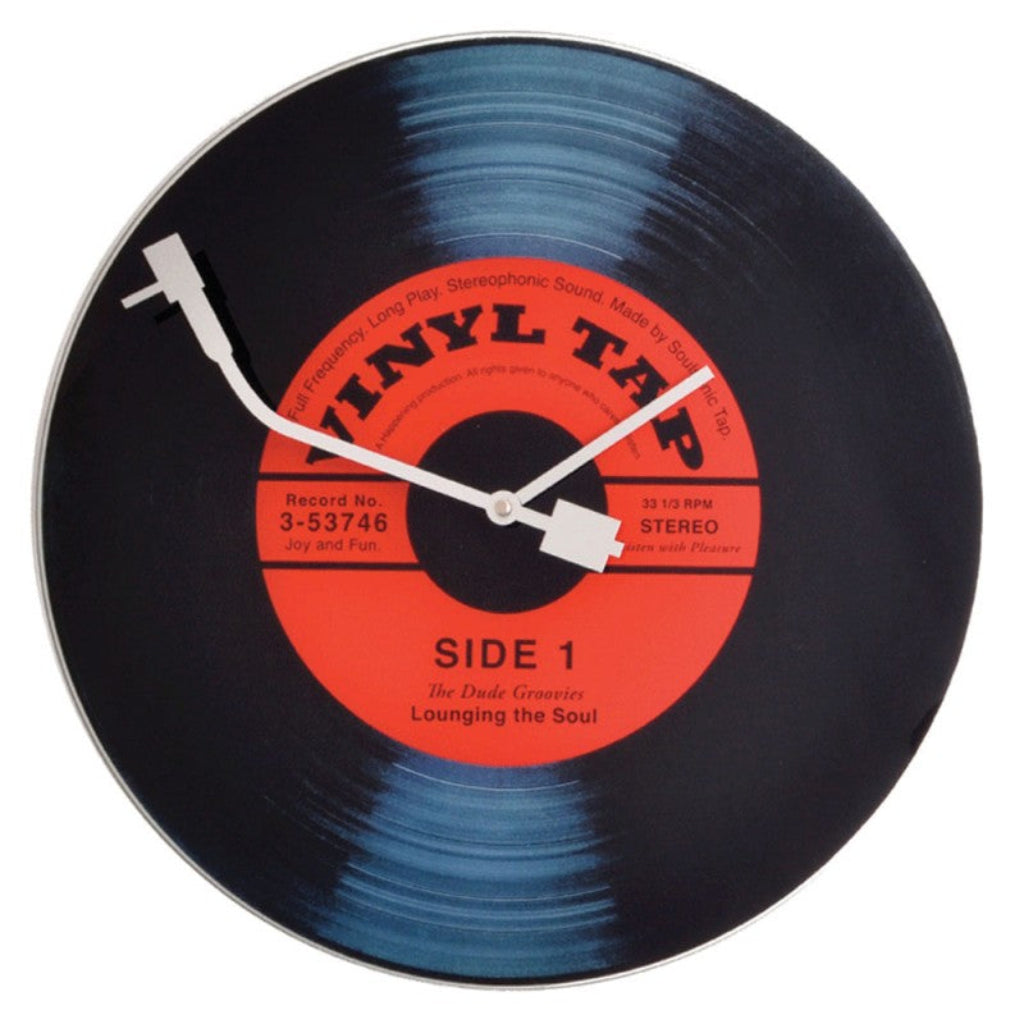 Vinyl record-shaped clock with a white turntable on a white  from Nextime available at Spacio retail stores in Mumbaii & Kolkata and online.background