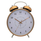 Bronze alarm clock with white face on a white background  from Nextime available at Spacio retail stores in Mumbaii & Kolkata and online.