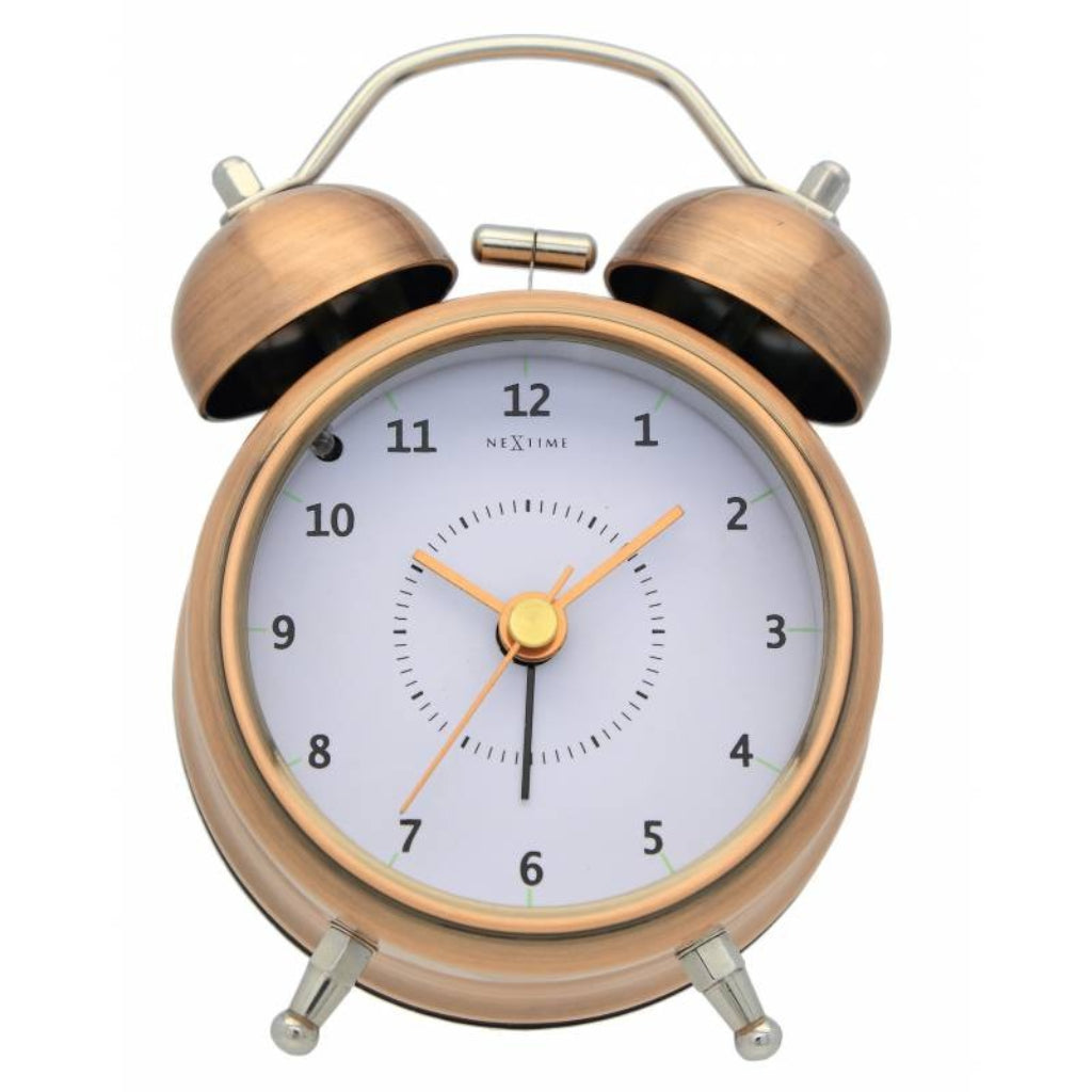 Bronze twin bell alarm clock with white face on a white background from Nextime available at Spacio retail stores in Mumbaii & Kolkata and online.