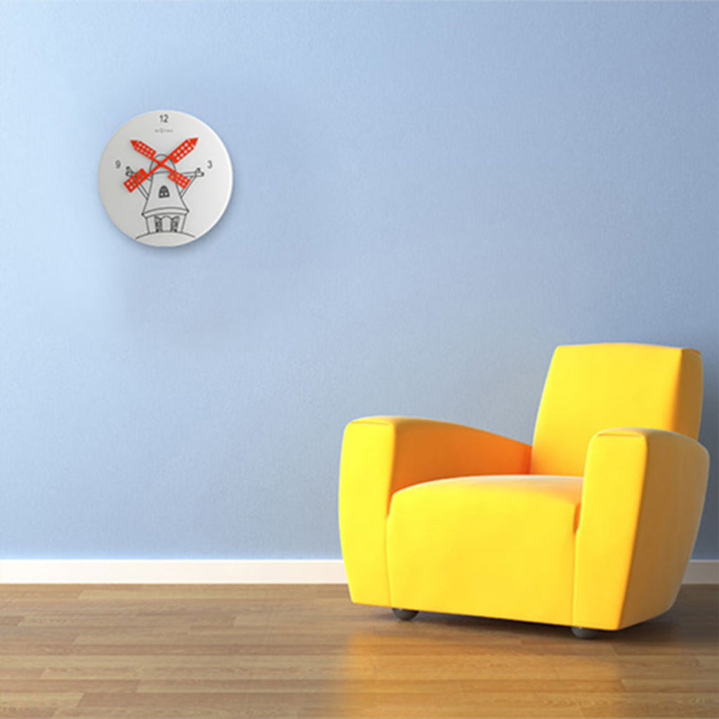 Yellow armchair in a room with a blue wall and a decorative clock.
