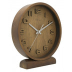 Wooden clock with white hands on a white background