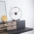 Modern wall-mounted console with clock and shelves on a white wall