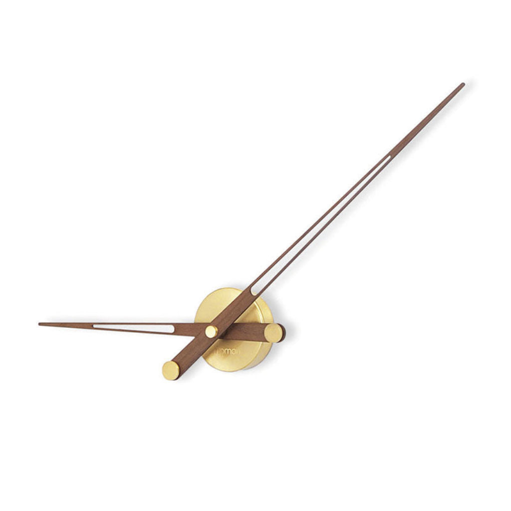 Add elegance to your space with the Nomon Axioma G Walnut 100 AXDGN Clock. This minimalistic wall clock features two sleek metal rods and a stylish clock face. available at Spacio retail stores in Mumbaii & Kolkata and online.