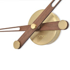Wall clock with wooden and brass design on a white background