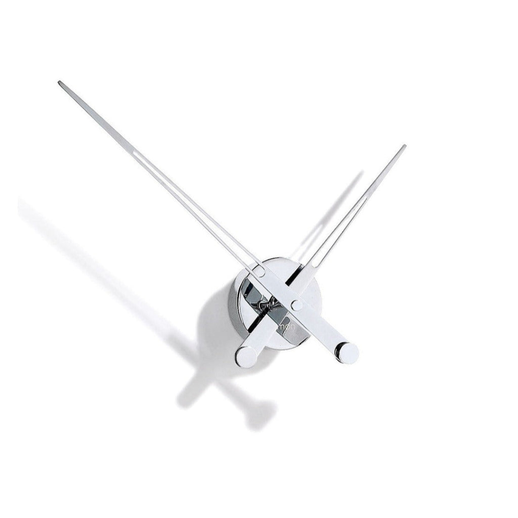 A Nomon wall clock with an avant-garde design featuring two swords: the Clock Nomon Axioma i 60 AXI. available at Spacio retail stores in Mumbaii & Kolkata and online.