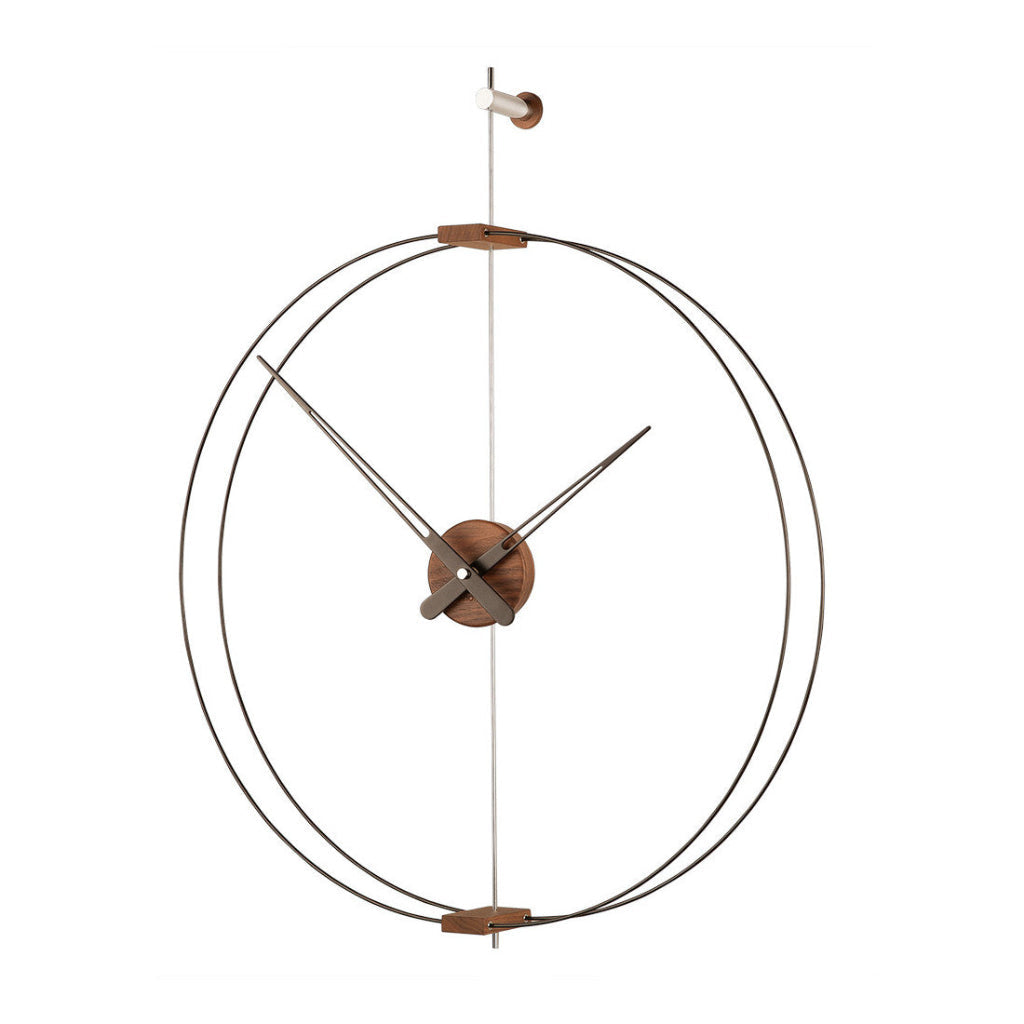 Decorative wall clock with metal design on a white background