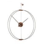 Decorative wall clock with metal design on a white background