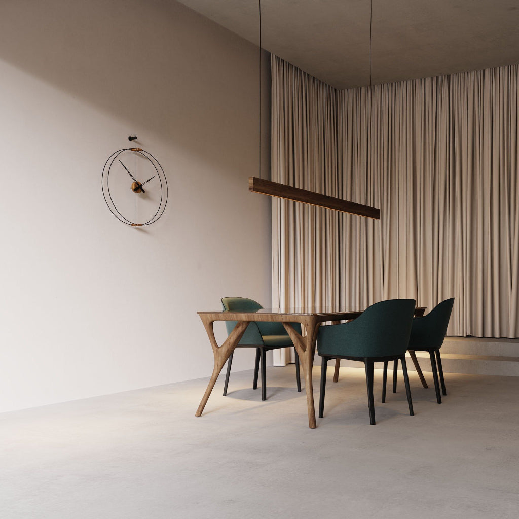 Modern dining area with wooden table and green chairs against a neutral wall.