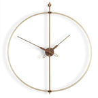 Modern wall clock with gold frame and wooden hands on a white background available at Spacio retail stores in Mumbaii & Kolkata and online.