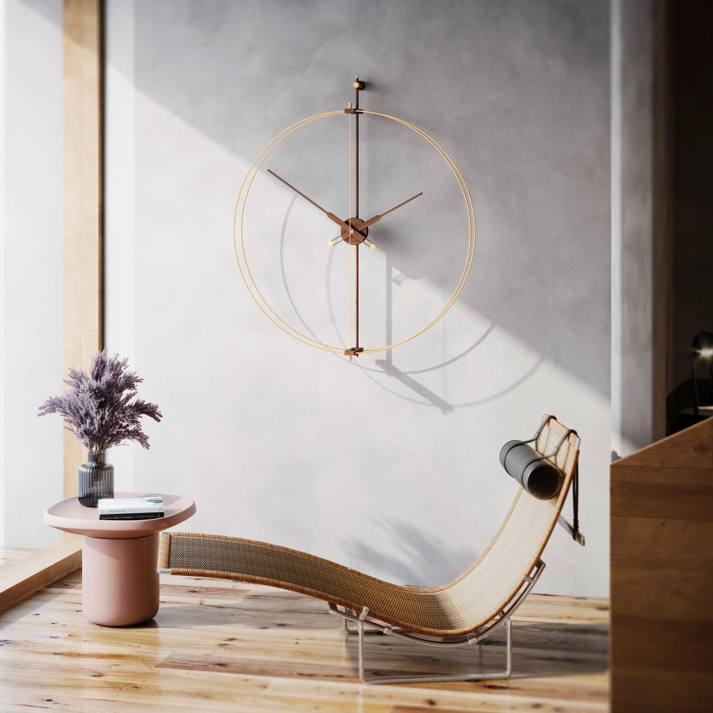 Modern interior with a chaise lounge, side table, and decorative clock.