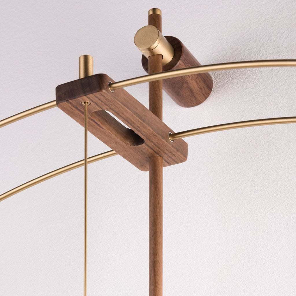 Chandelier with wooden and gold fixtures on a white background