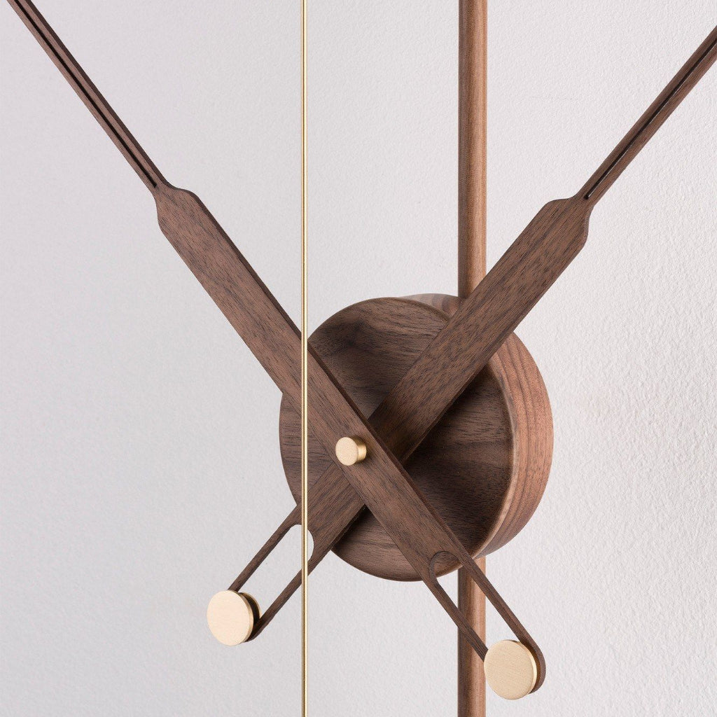 Wooden clock hands on a white background