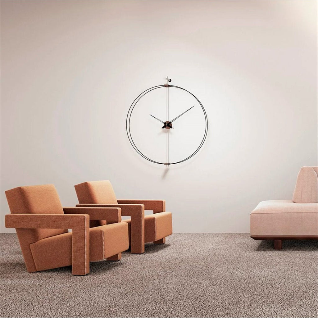 Modern armchairs and a wall clock in a minimalistic room.