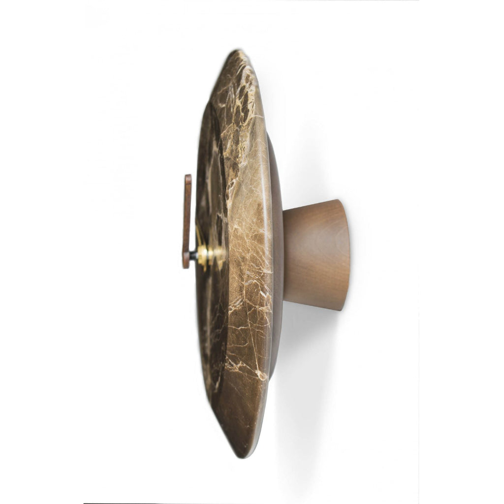 Decorative wall sconce with marble-like finish on a white background