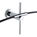 Chrome wall-mounted shower control with black hose on a white background