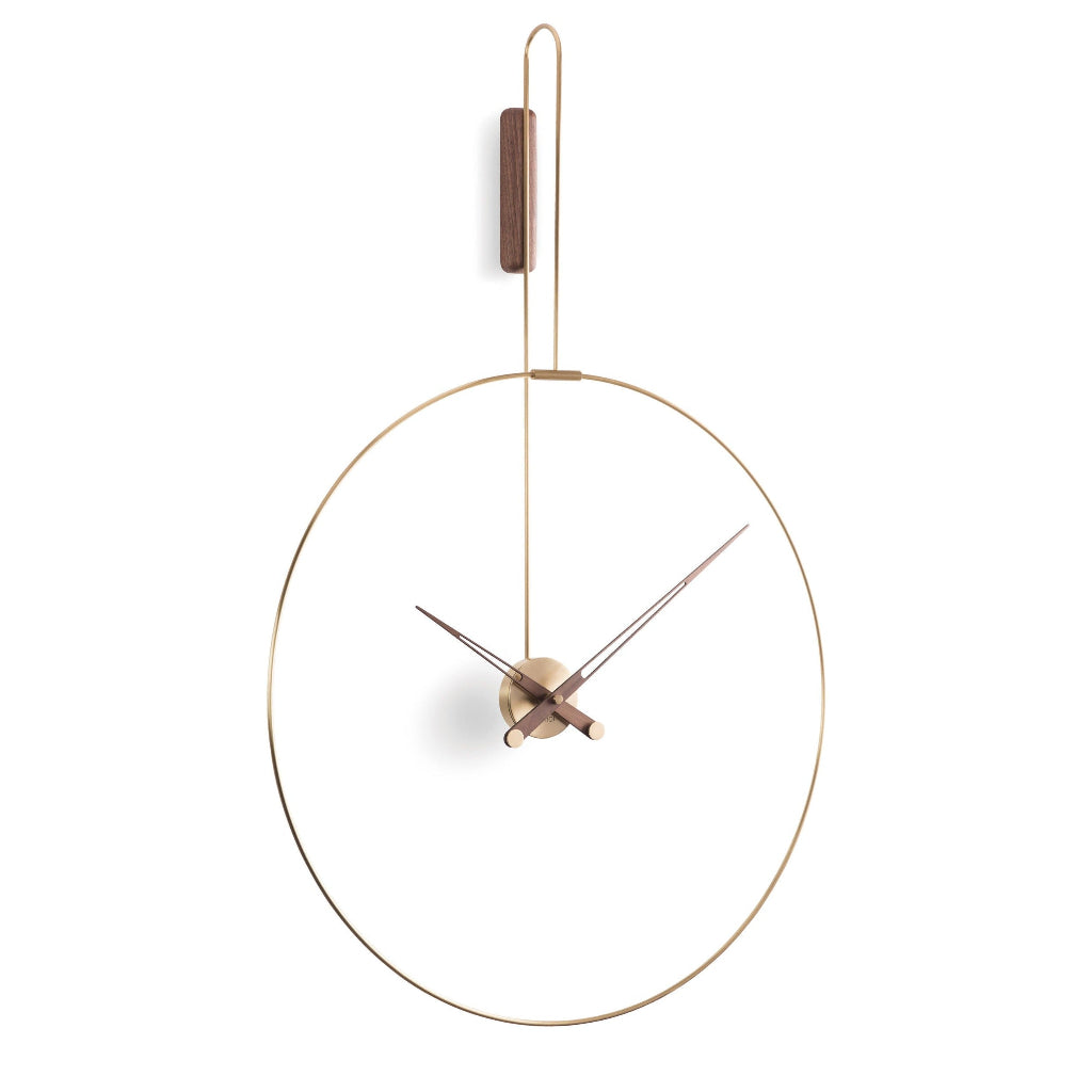 An elegant Nomon wall clock with a circular shape, perfect for a modern living area. available at Spacio retail stores in Mumbaii & Kolkata and online.