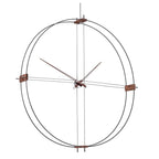 Decorative wall clock with metal frame and minimal design on a white background
