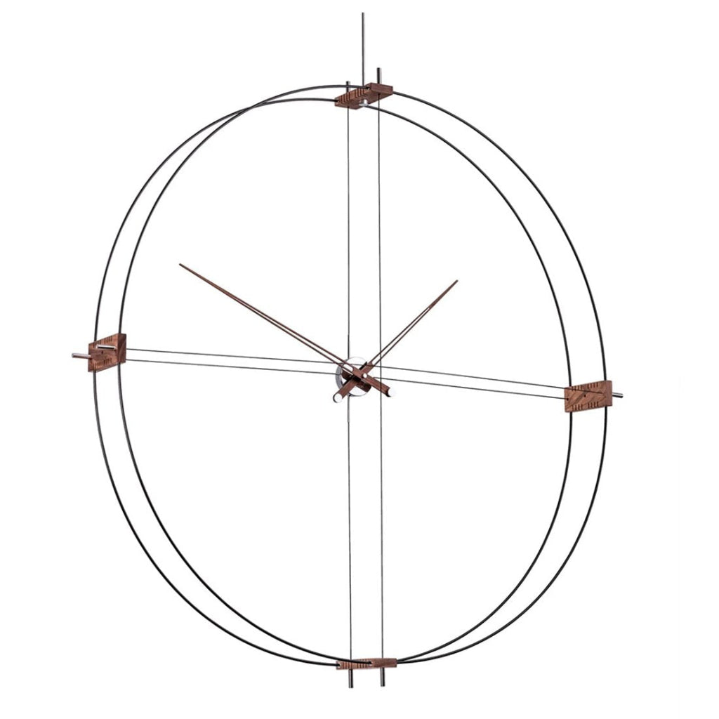Decorative wall clock with metal frame and minimal design on a white background