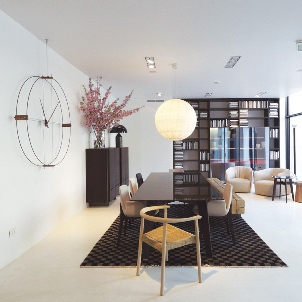 Modern interior design of a living room with a dining table and chairs.